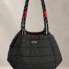 کیف دوشی پف‌دار برند توپولوژی با بند طنابی دو رنگ و لوگوی سفید در استایل | Padded Topologie shoulder bag with contrast rope strap and white logo, in-hand