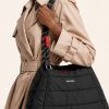 کیف دوشی پف‌دار برند توپولوژی با بند طنابی دو رنگ و لوگوی سفید در استایل | Padded Topologie shoulder bag with contrast rope strap and white logo, in-hand