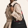کیف دوشی پف‌دار برند توپولوژی با بند طنابی دو رنگ و لوگوی سفید در استایل | Padded Topologie shoulder bag with contrast rope strap and white logo, in-hand