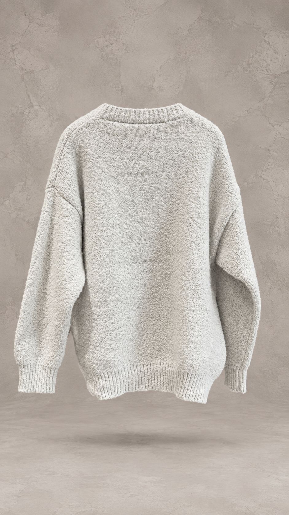 پلیور بافت تدی ضخیم با تایپوگرافی برجسته STM بر روی سینه در استودیوی مینیمال | Bouclé knit sweater with textured green STM front typography floating in minimal studio setting
