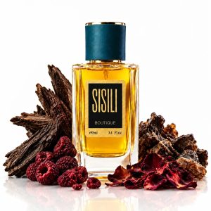 عطر نیش امبر نومد با بطری شیشه‌ای استوانه‌ای دودی-قهوه‌ای تیره، نوشته طلایی و درپوش مغناطیسی مشکی لوکس | Ombre Nomade luxury perfume bottle with dark smoky amber glass, gold typography, and magnetic black cap