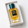 عطر ادکلن سیسیلی بوتیک ۸۵ میلی‌لیتر، شیشه کهربایی با درب سبز تیره روی پس‌زمینه سفید